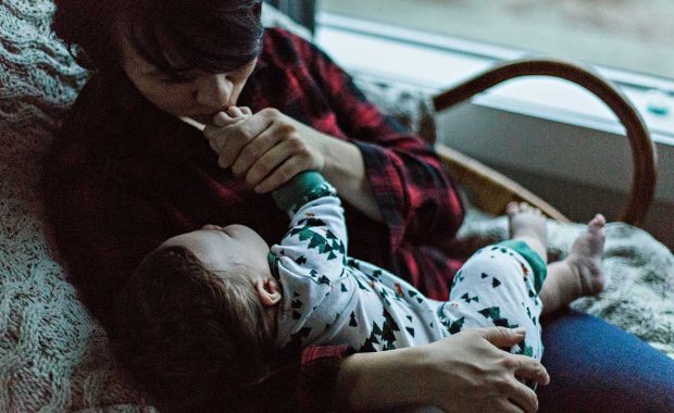toddler and parent snuggle