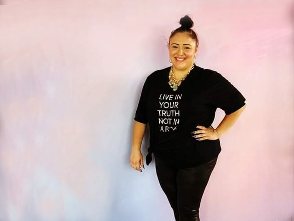 Smiling female poses for photo