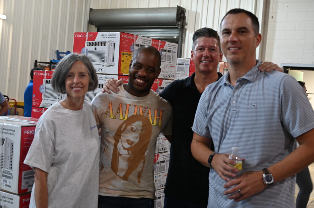 Electrolux volunteers and George at Crisis Assistance Ministry.